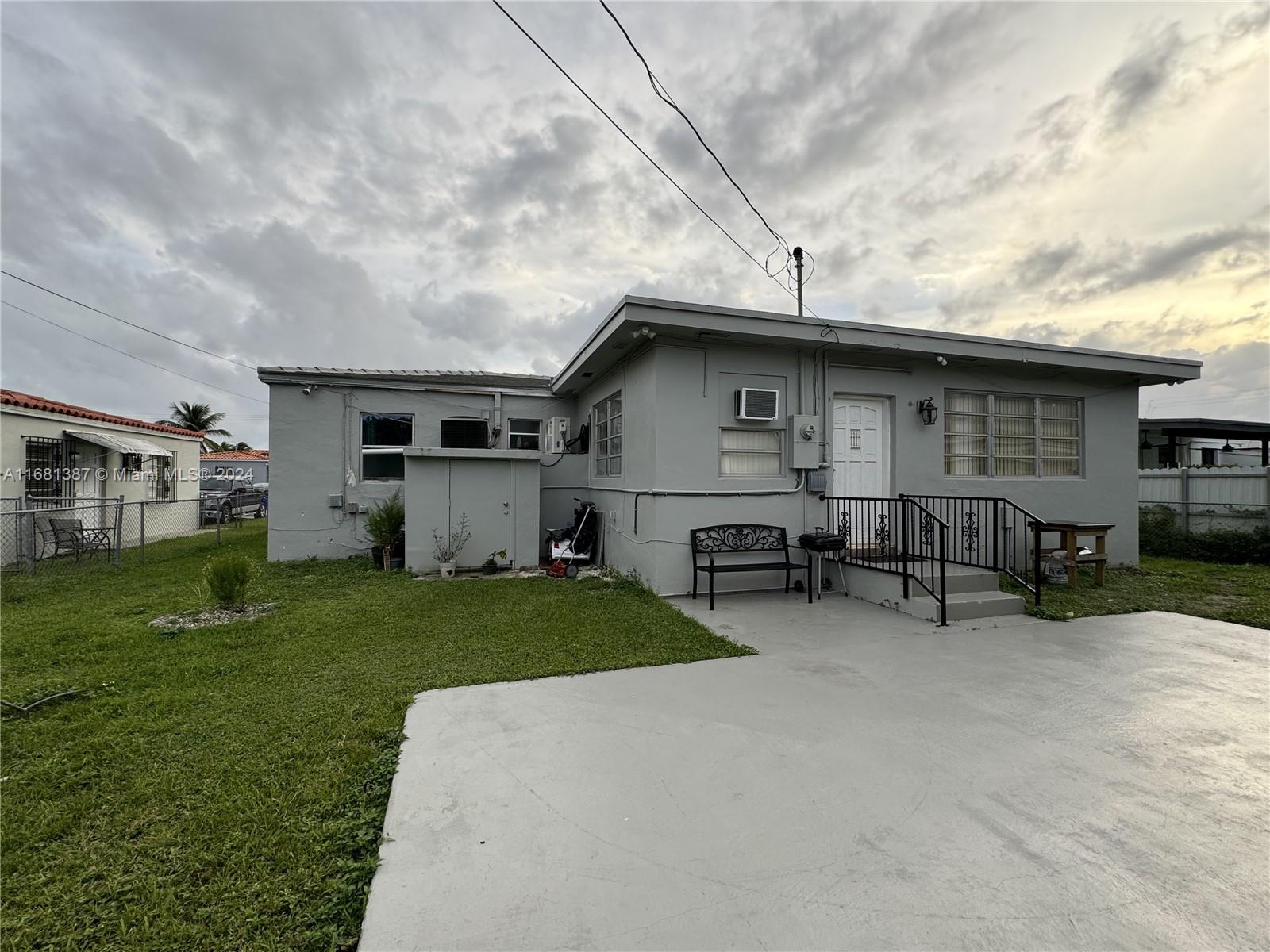 a view of a house with a back yard