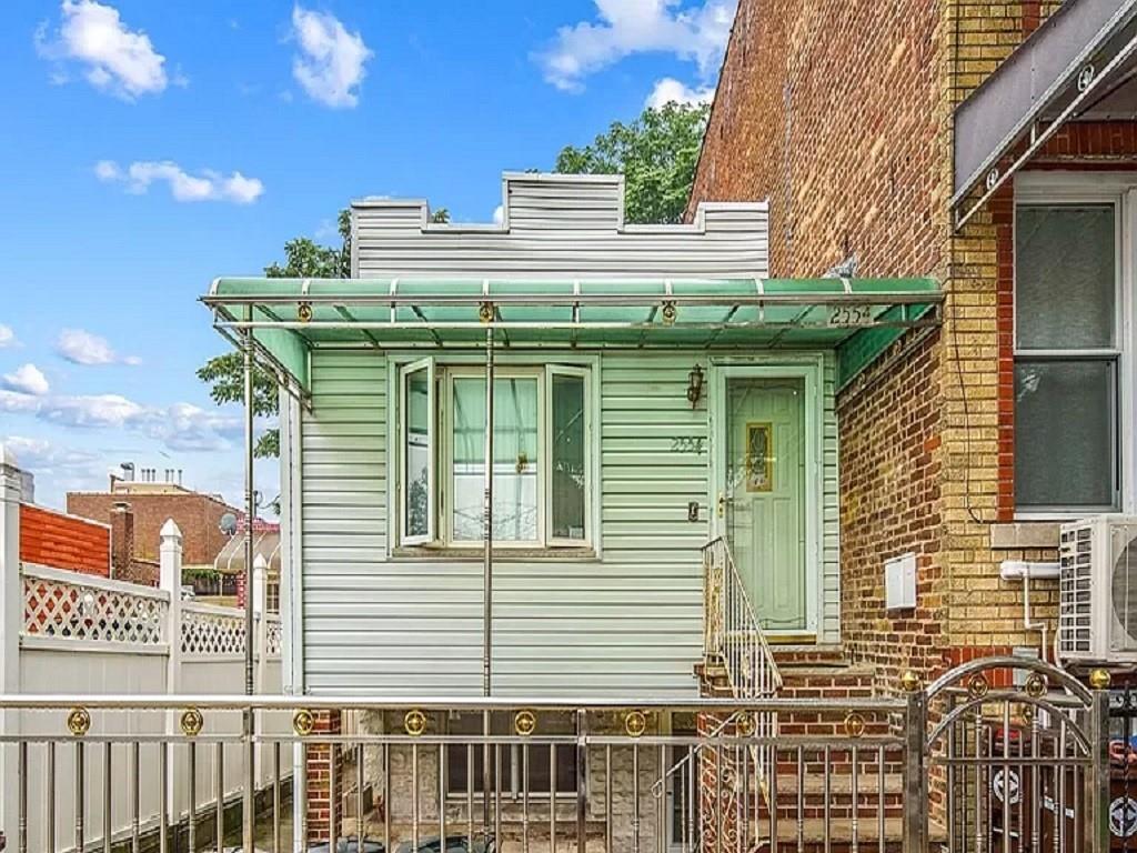 a front view of a house with a balcony