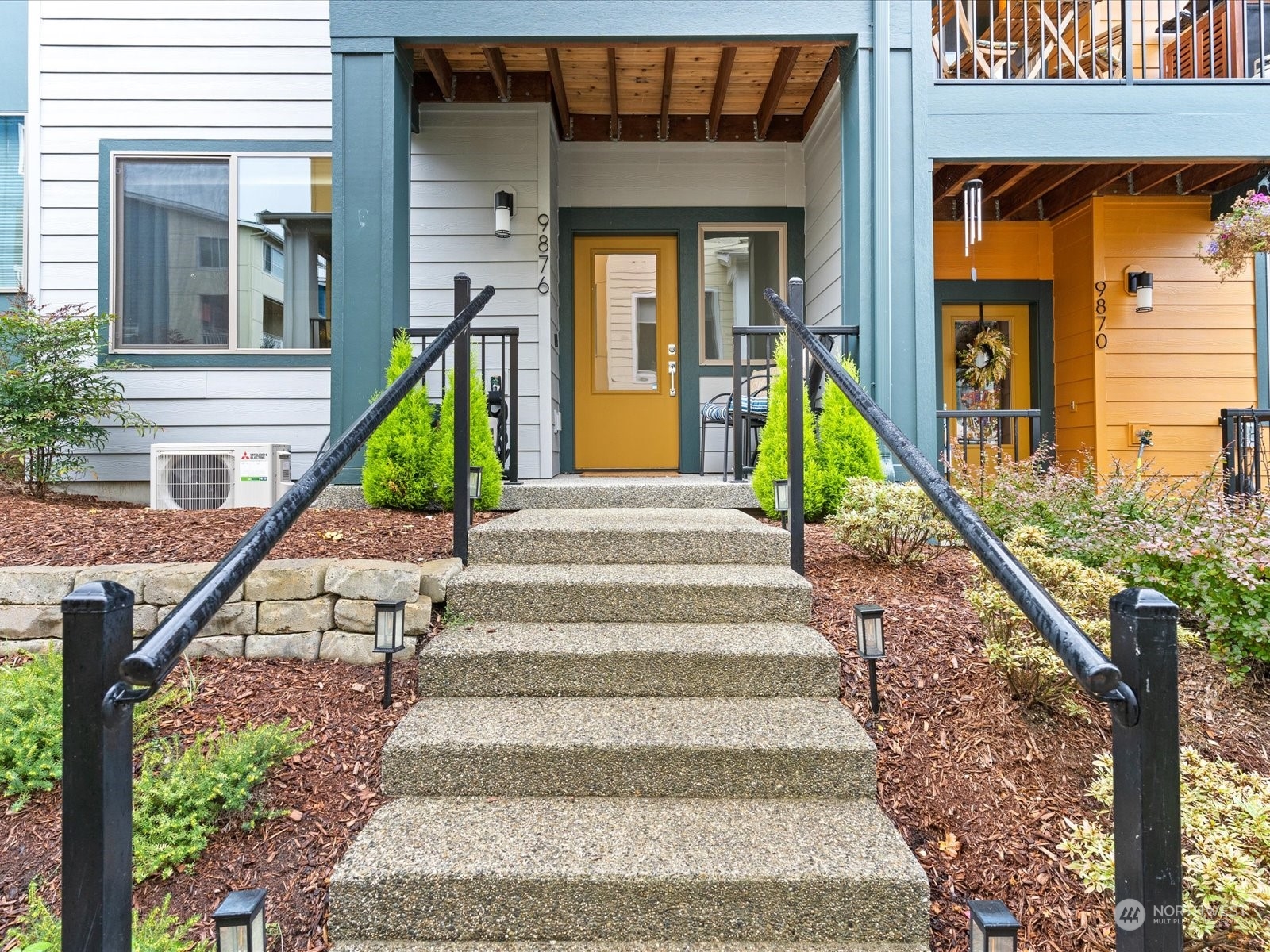 a view of stairs and small white building