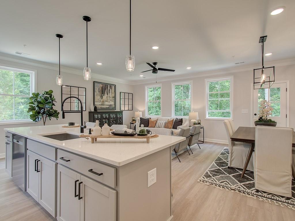 a open kitchen with sink stove and cabinets