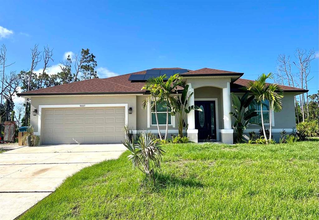 a front view of a house with a yard