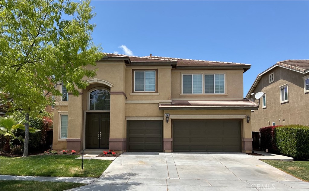 a front view of a house with a garage