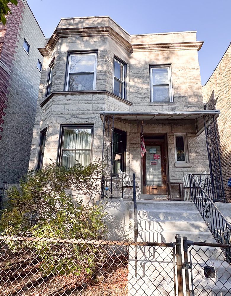 a front view of a house with large windows