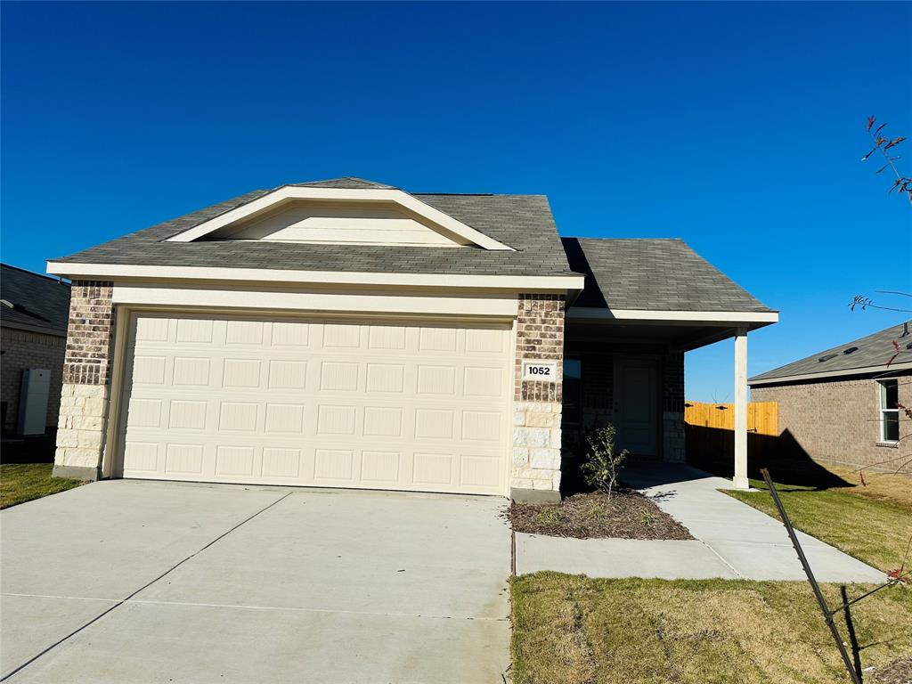 a front view of a house with garage