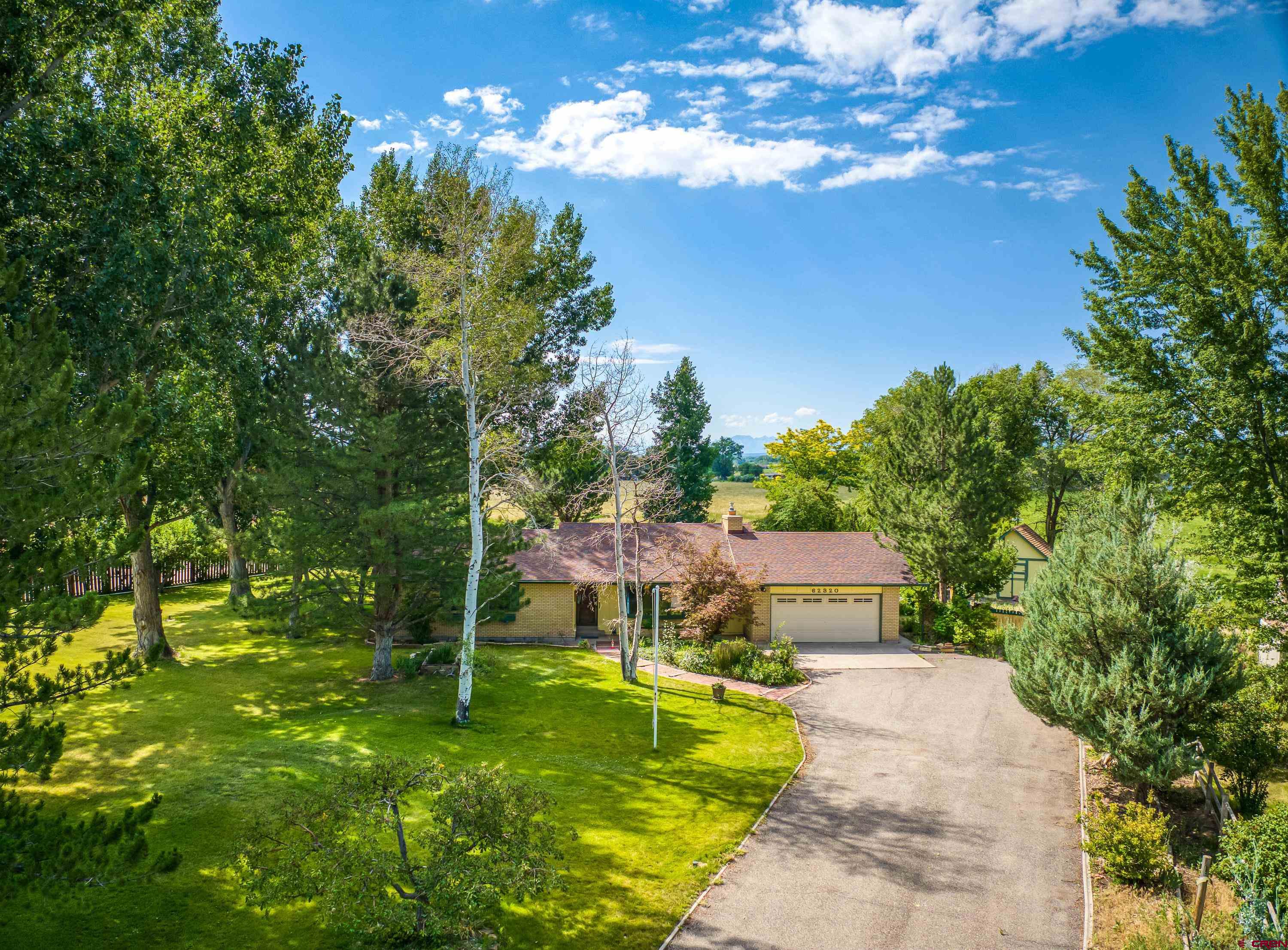 a view of a house with a big yard