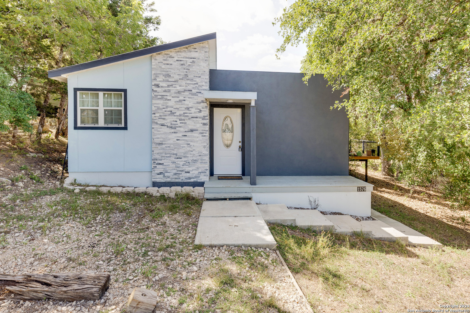 front view of a house with a yard