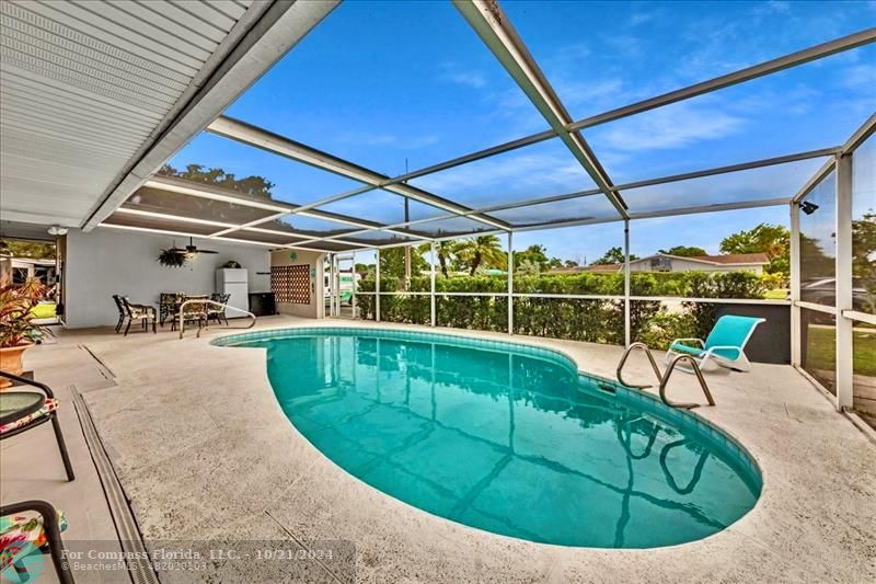 a view of a swimming pool with a patio