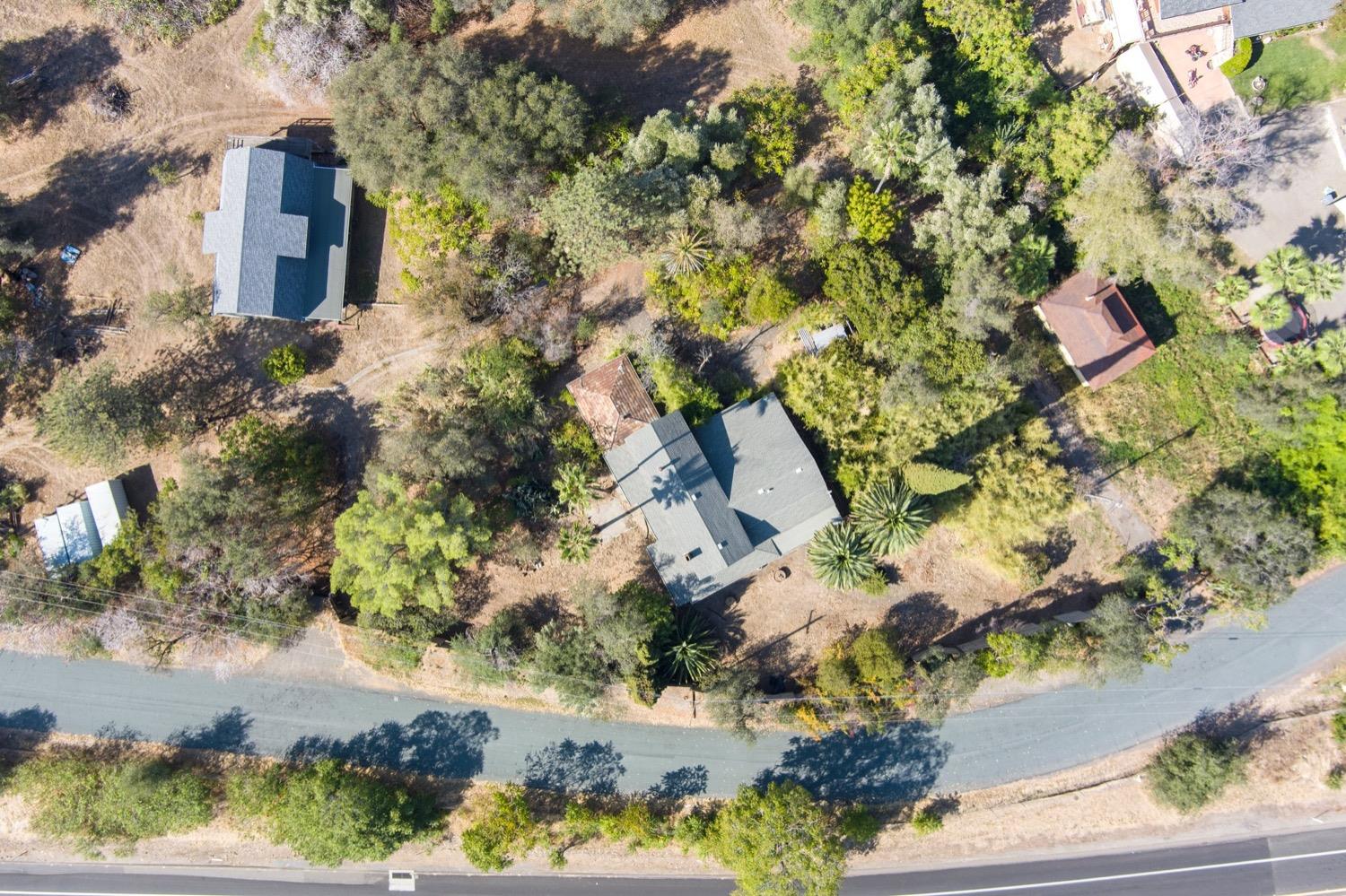 an aerial view of residential house with outdoor space