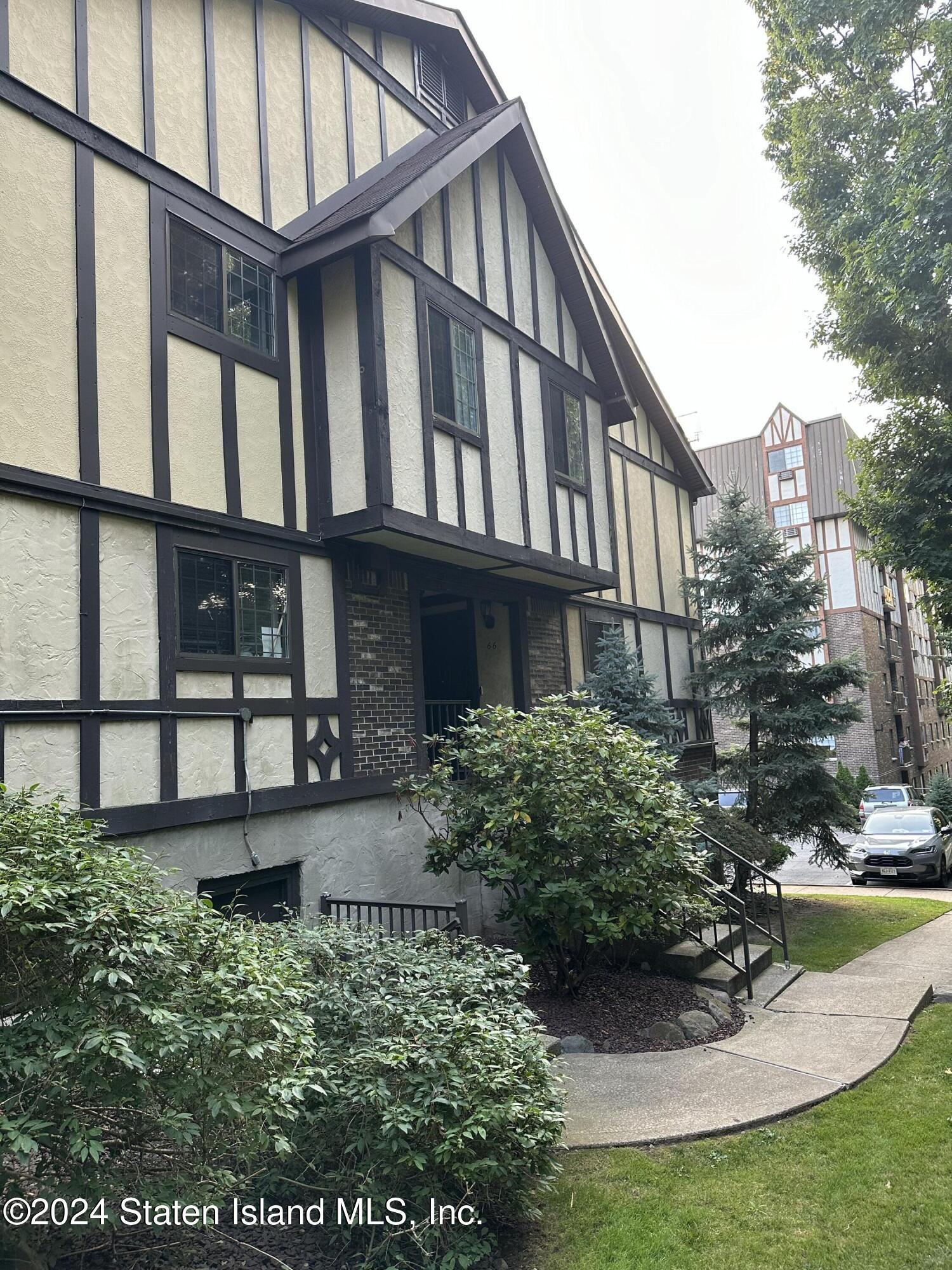 a view of a house with brick walls