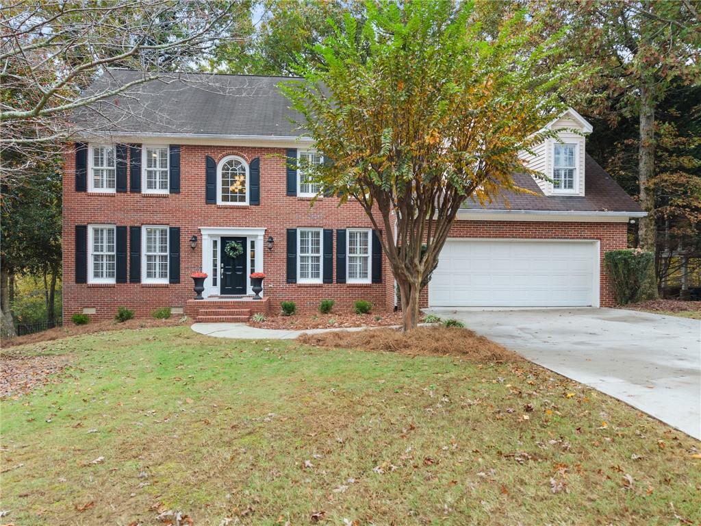 front view of a house with a yard