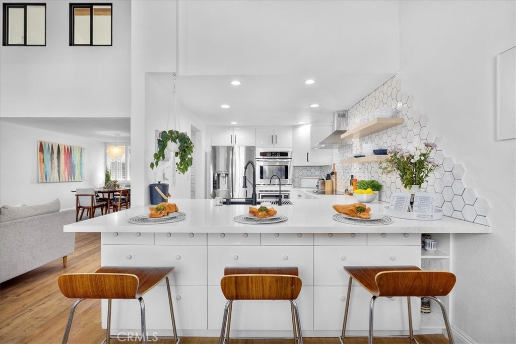 a kitchen with stainless steel appliances granite countertop counter space a sink and cabinets