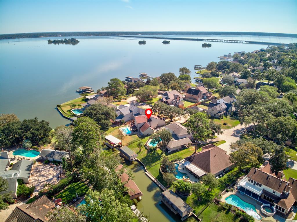 an aerial view of a houses with a yard