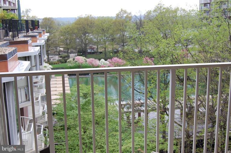 a view of a balcony with lake view and city view