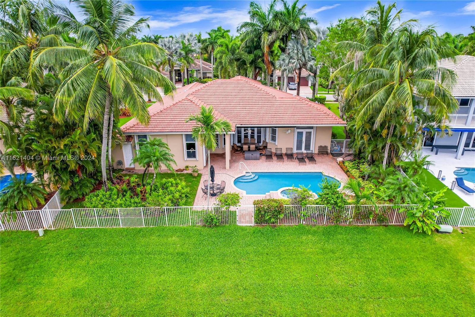 a view of a house with a yard and sitting area