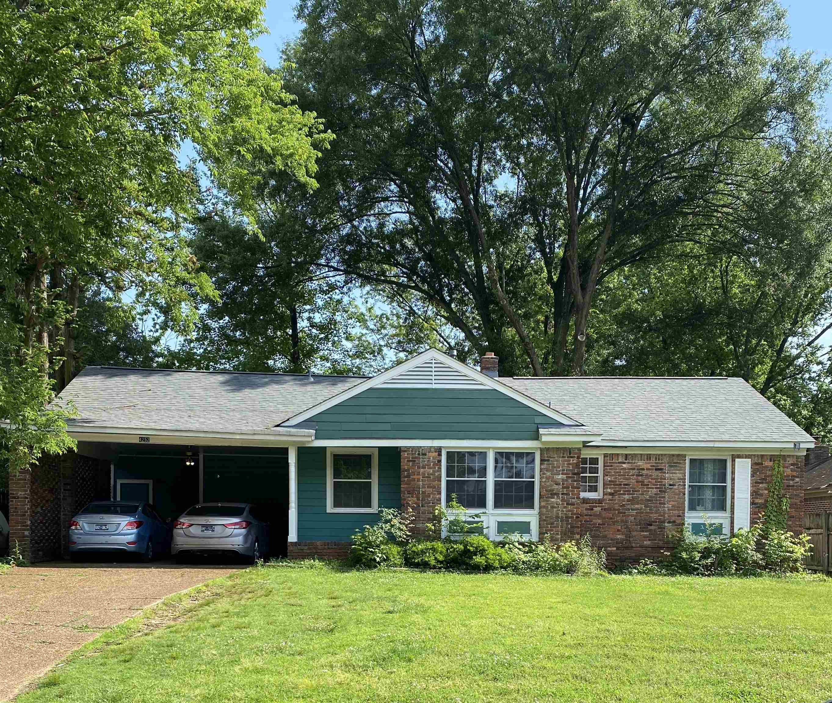 front view of a house with a yard