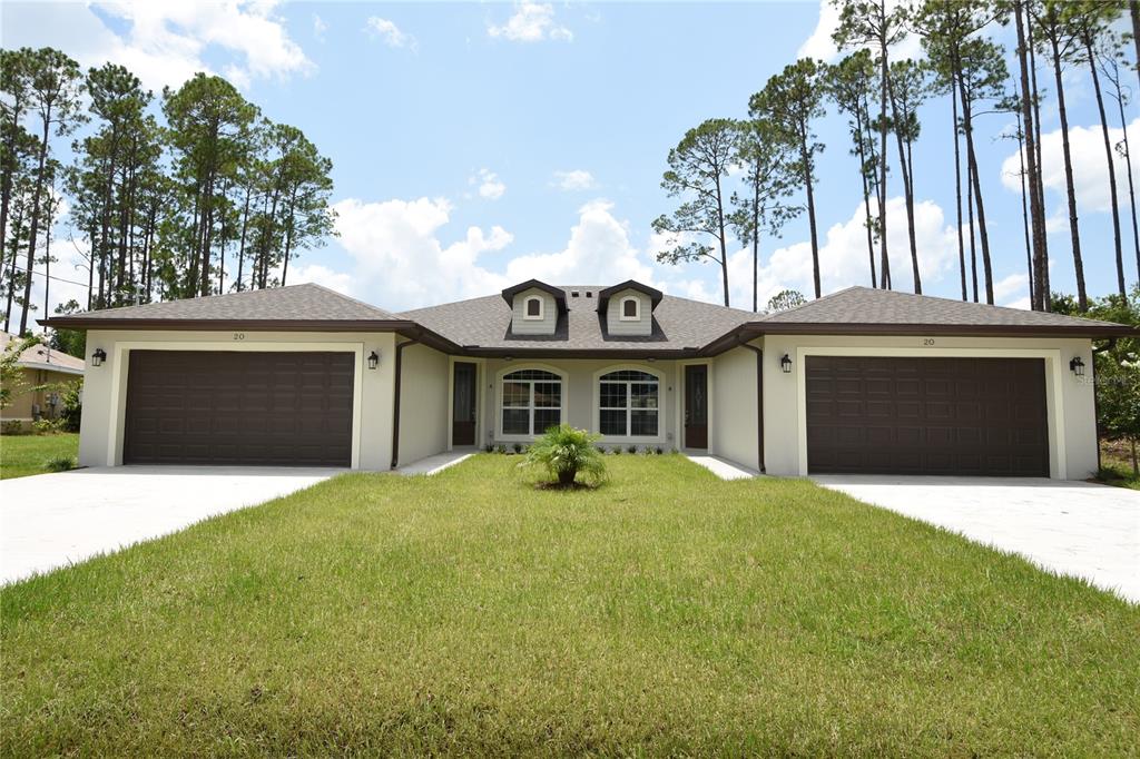 a front view of a house with yard