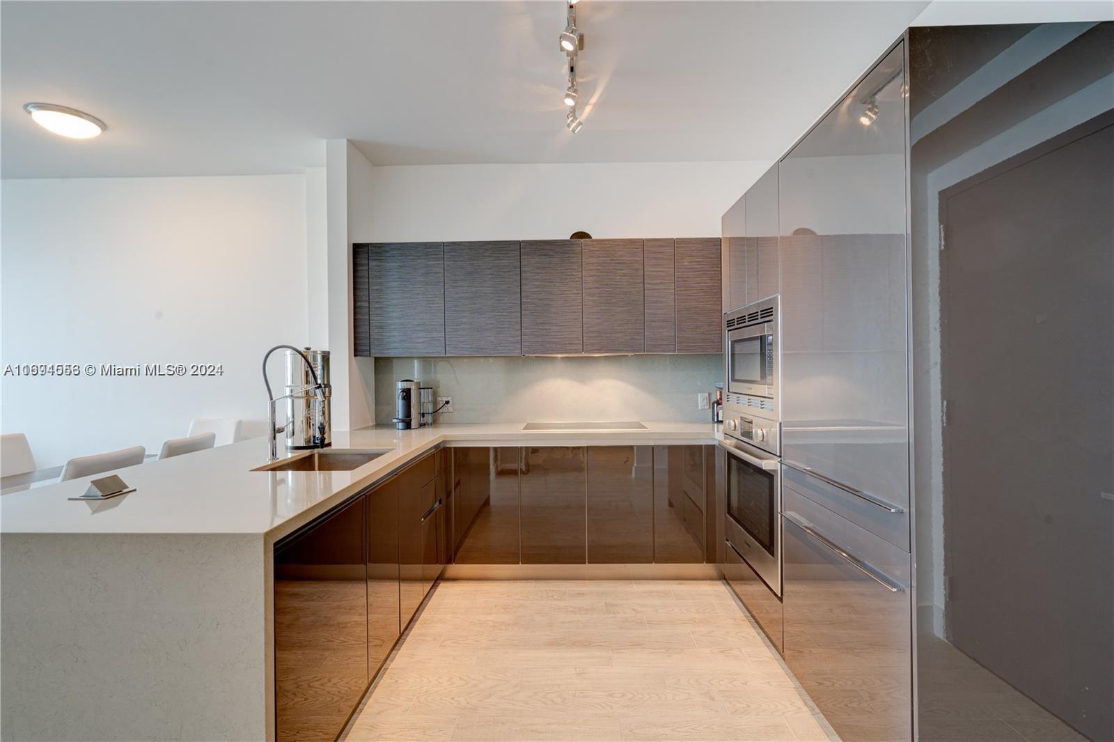 a kitchen with a sink and cabinets