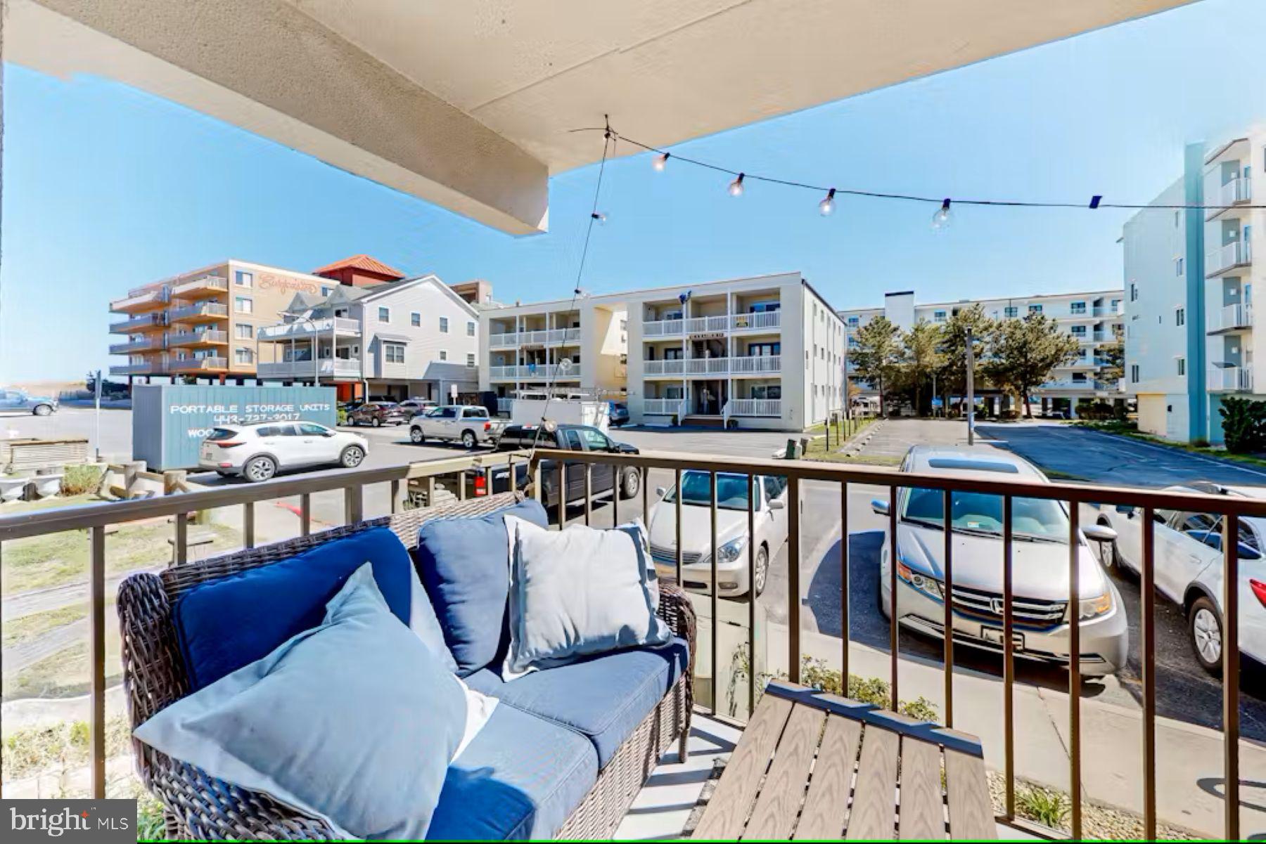 a balcony with furniture and city view