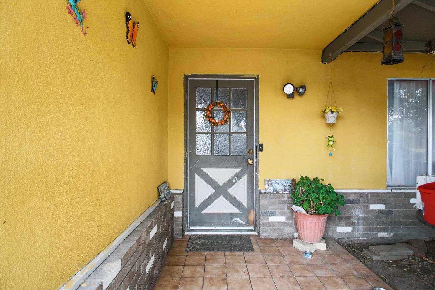 a house view with a potted plant