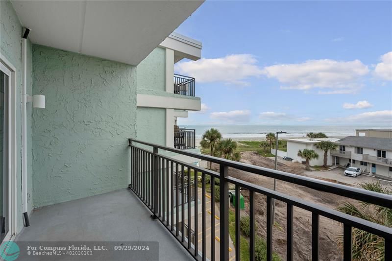 a view of a balcony with city view