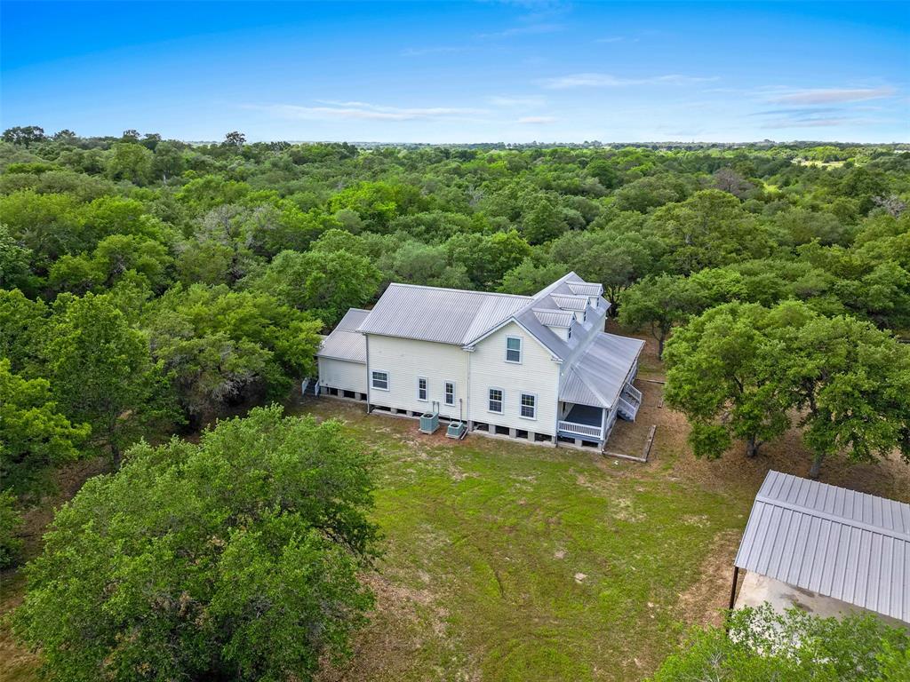 a view of a house with a big yard