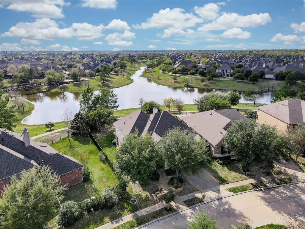 an aerial view of a house with a lake view