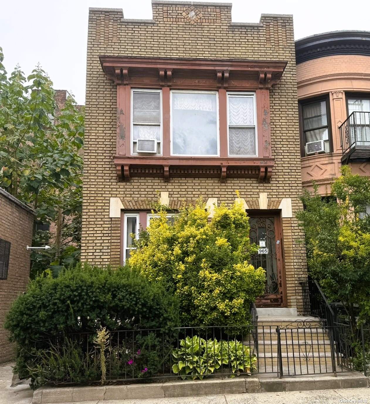 front view of a house with a small yard