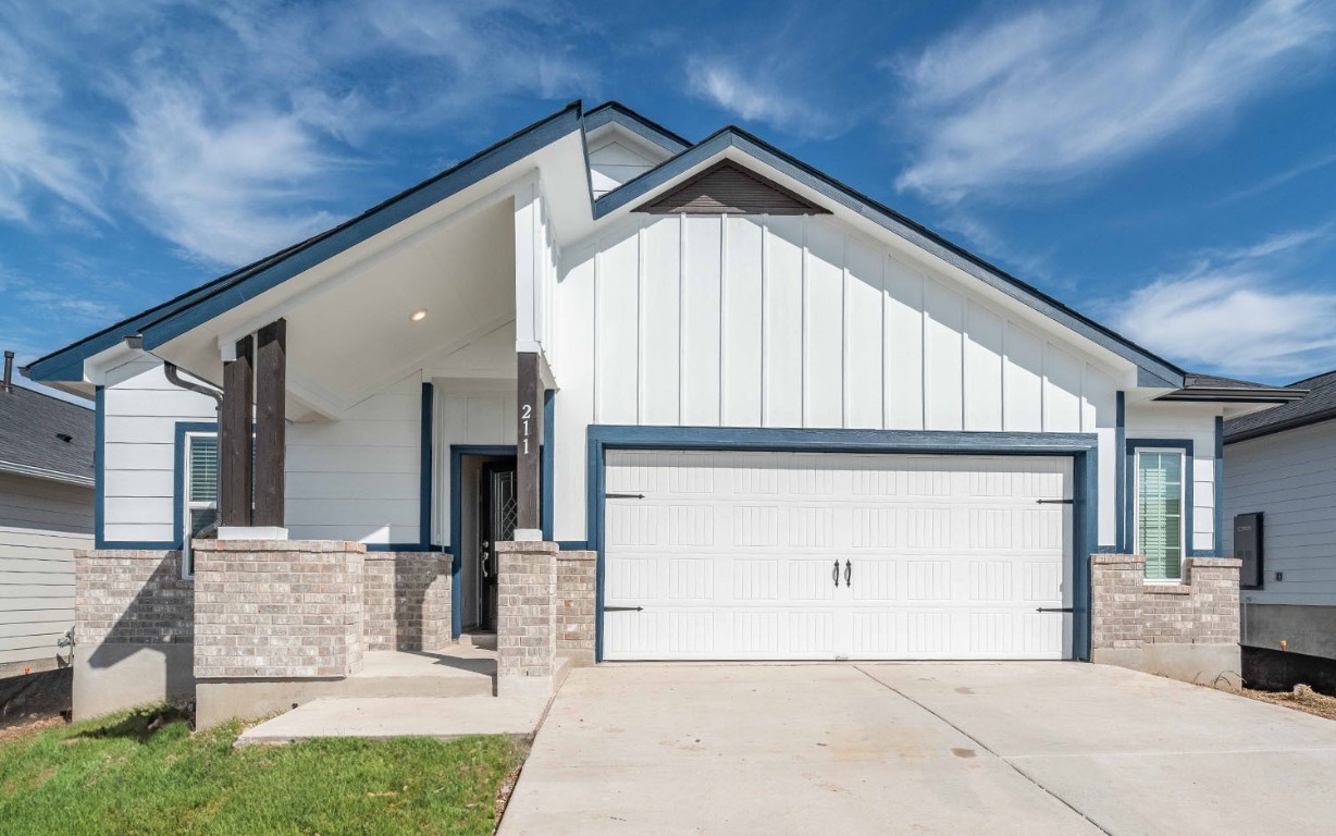 a front view of a house with a garage