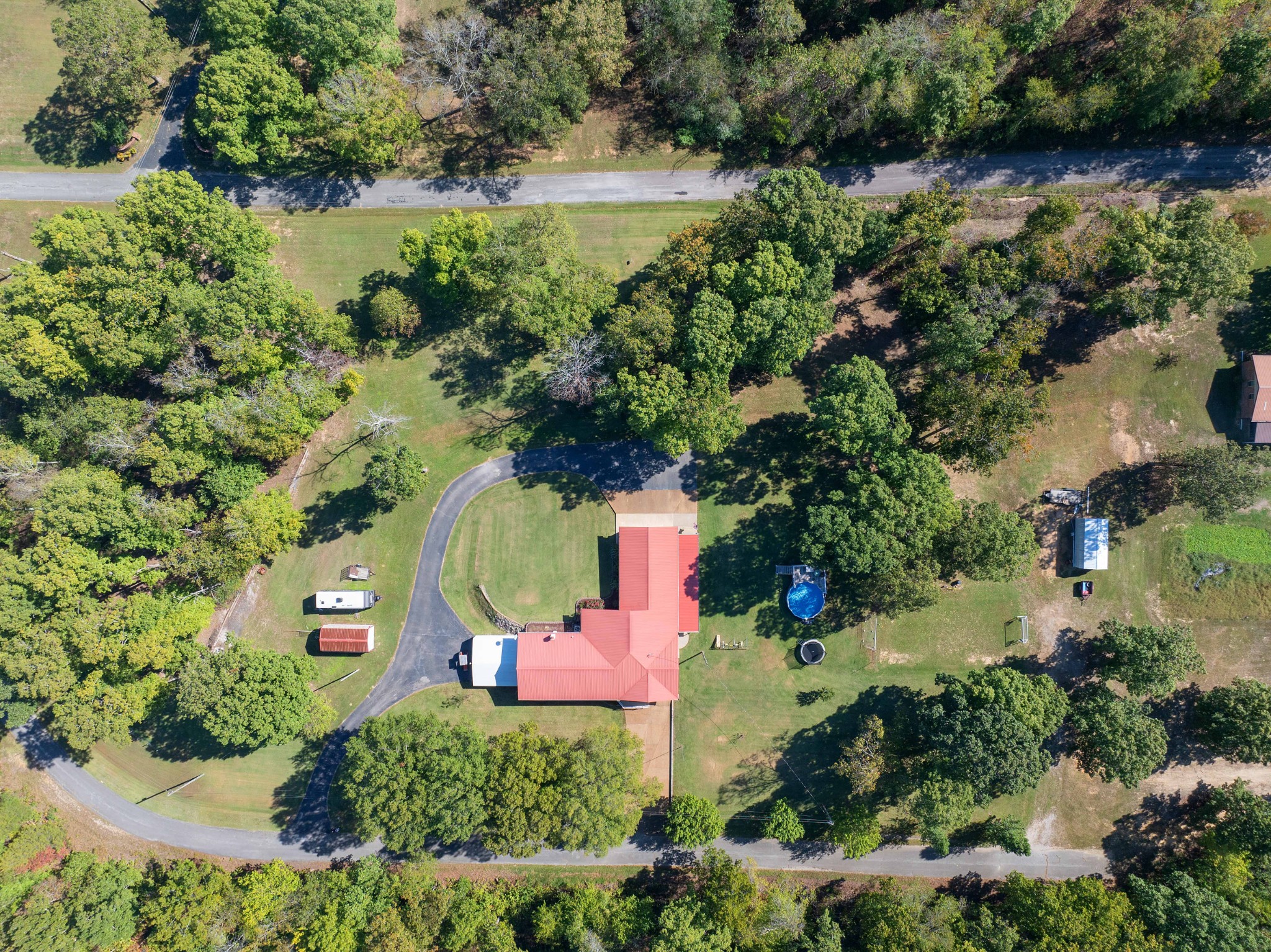 an aerial view of residential house with outdoor space and lake view