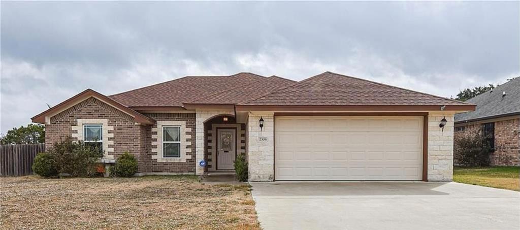 a front view of a house with a garage