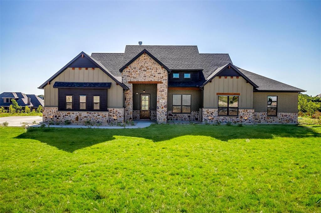 a front view of a house with swimming pool having outdoor seating