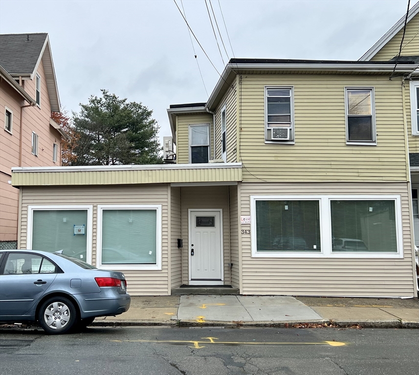 a view of a car parked in front of a house