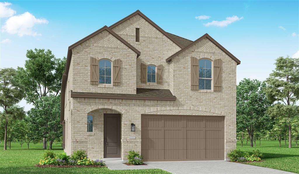 a front view of a house with garage and yard