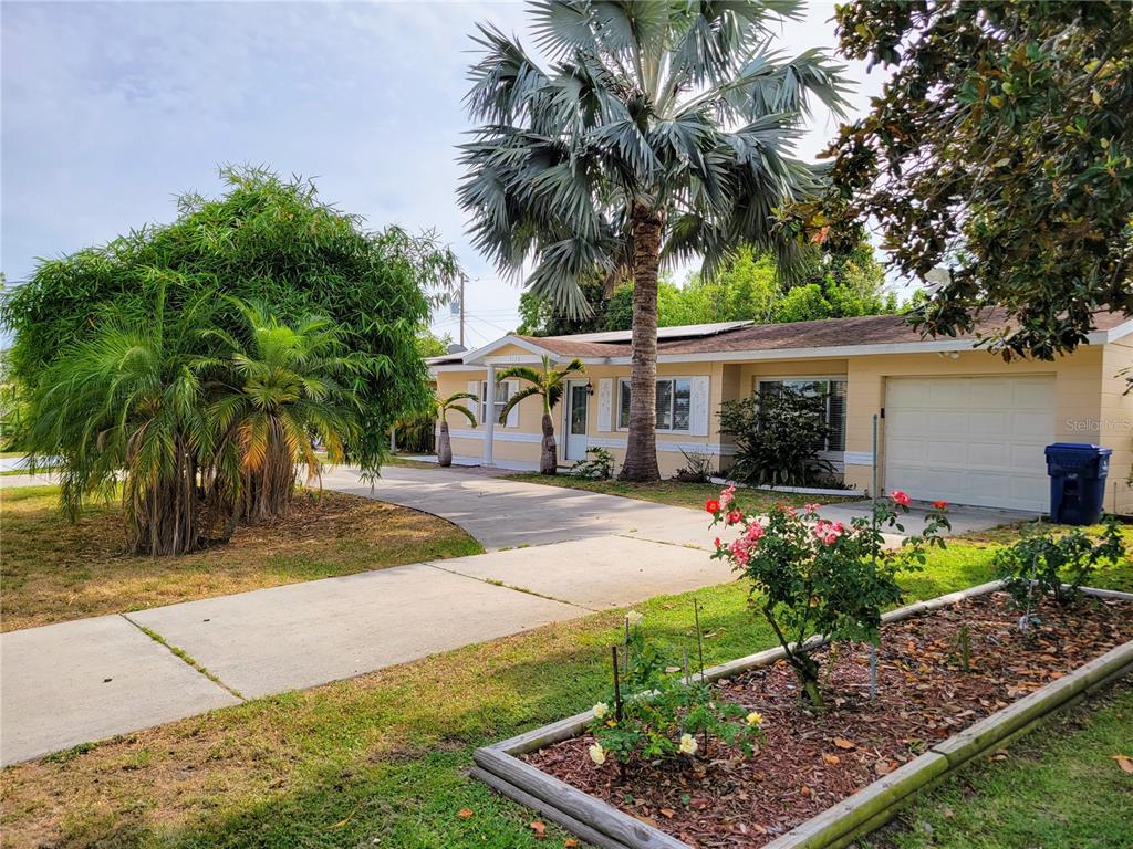 a front view of a house with garden