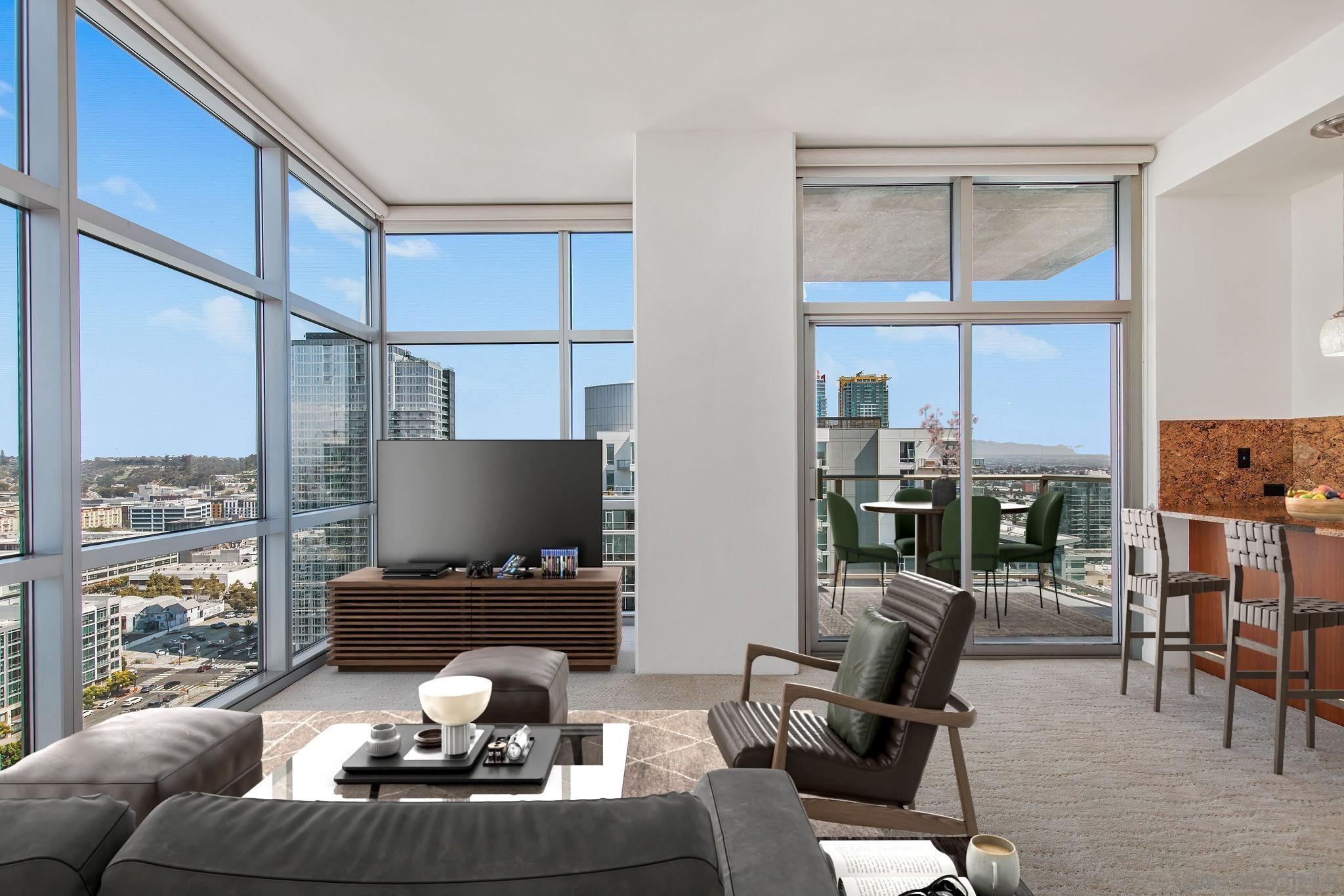 a living room with furniture a lamp and large window