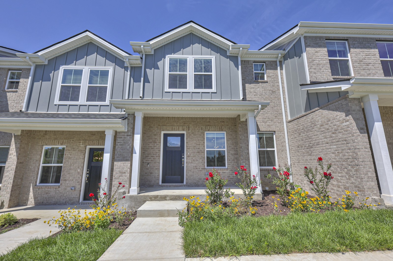 a front view of a house with garden