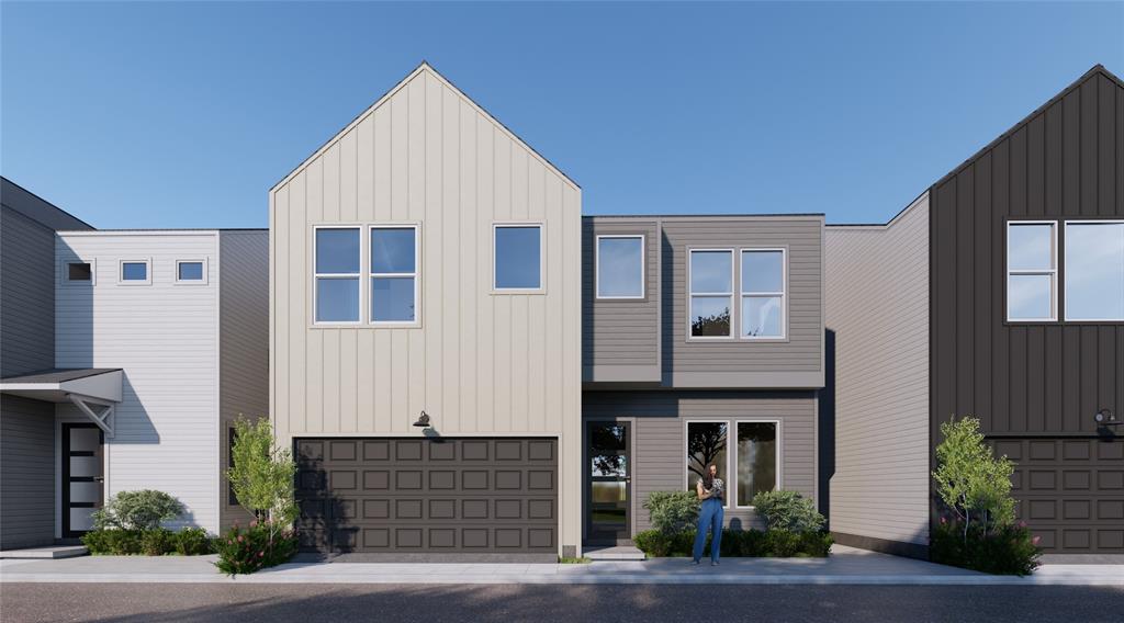 a front view of a house with garage