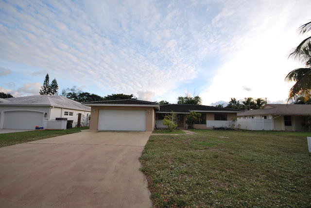 front view of a house with a yard