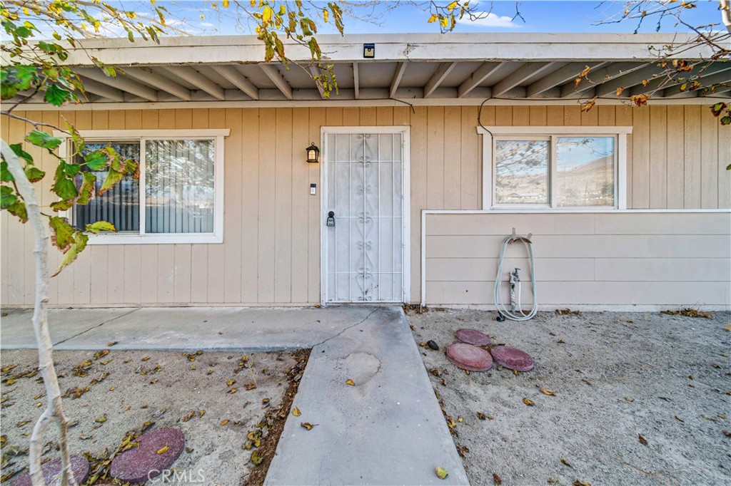 a view of a backyard with a wooden fence