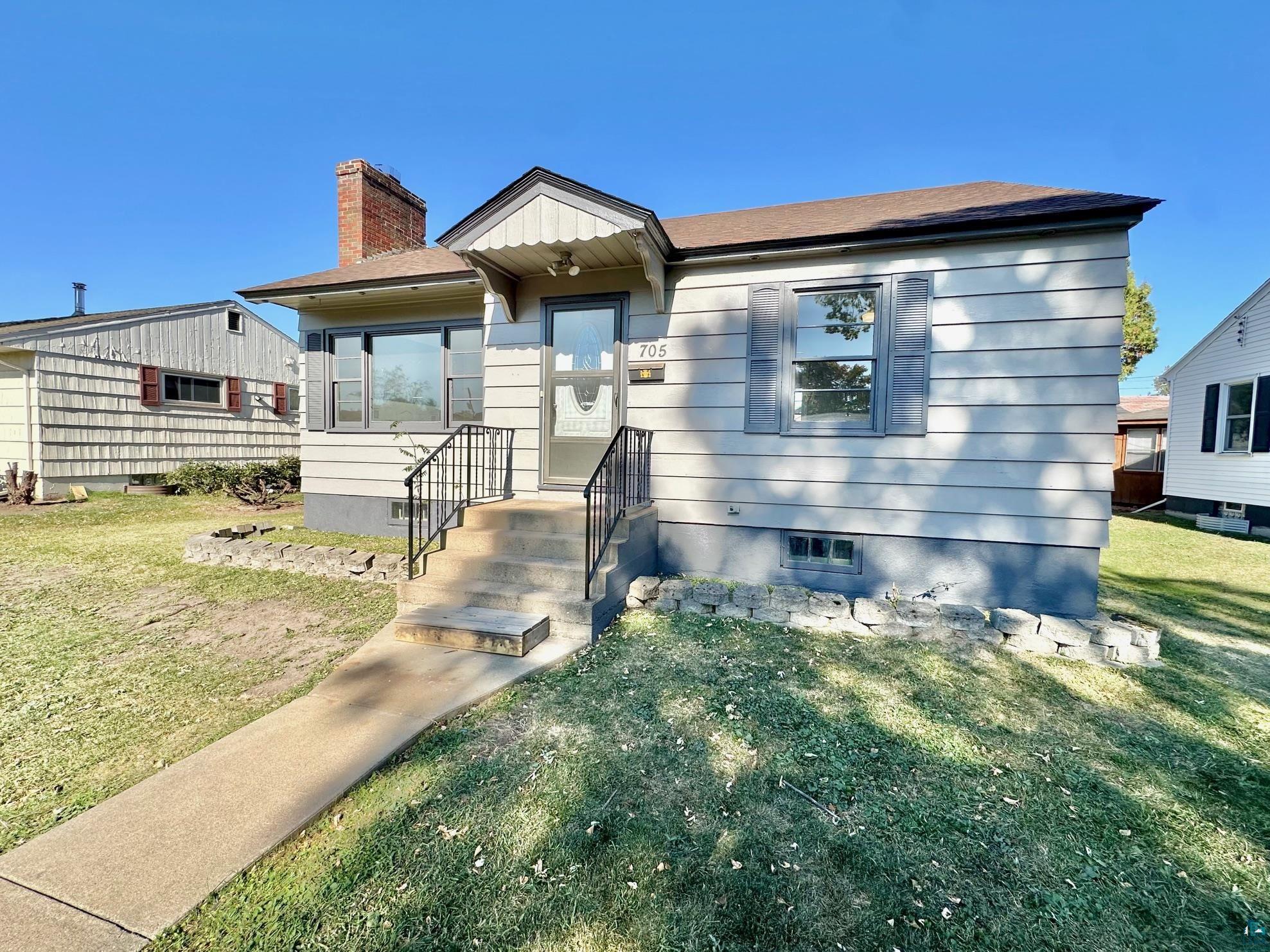 View of front of house with a front yard