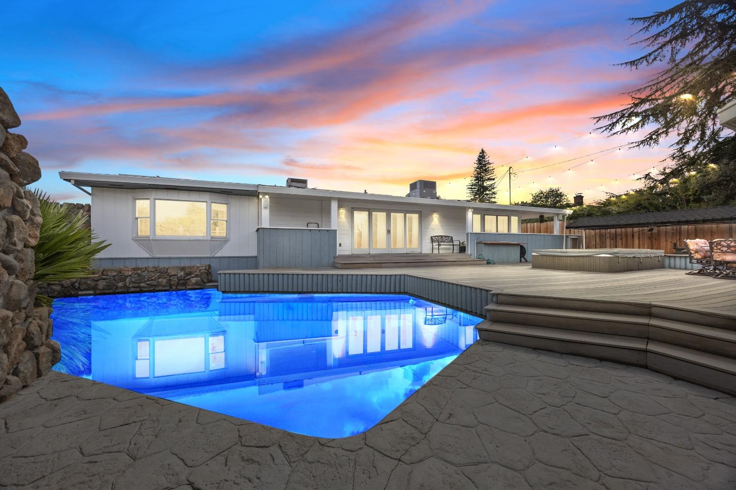 a view of swimming pool with outdoor seating