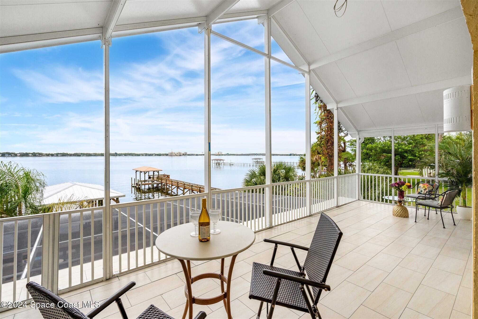 a view of a balcony with chairs and a table