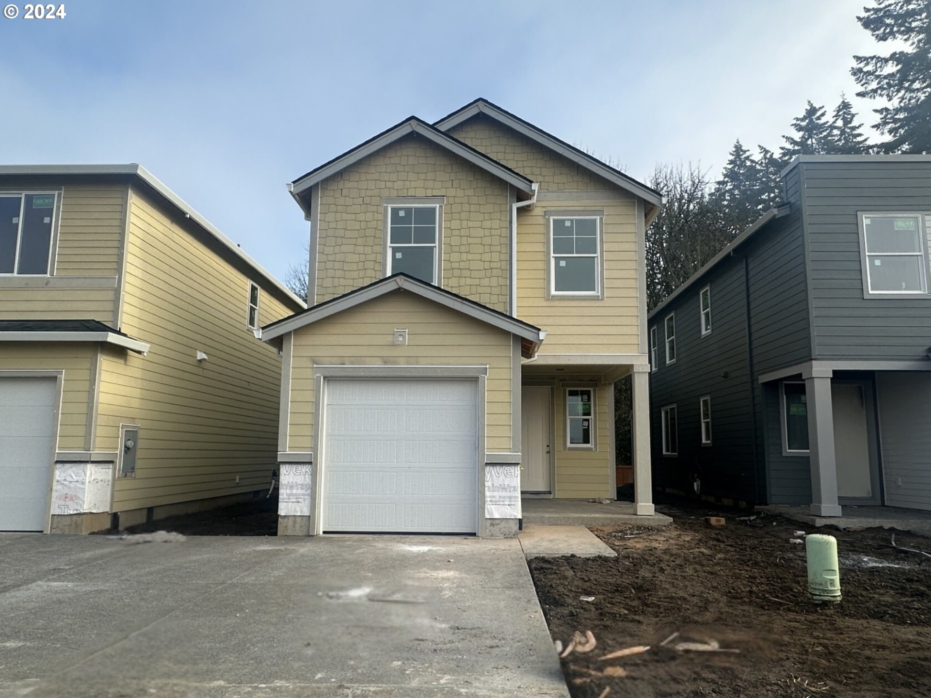 a front view of a house with garage