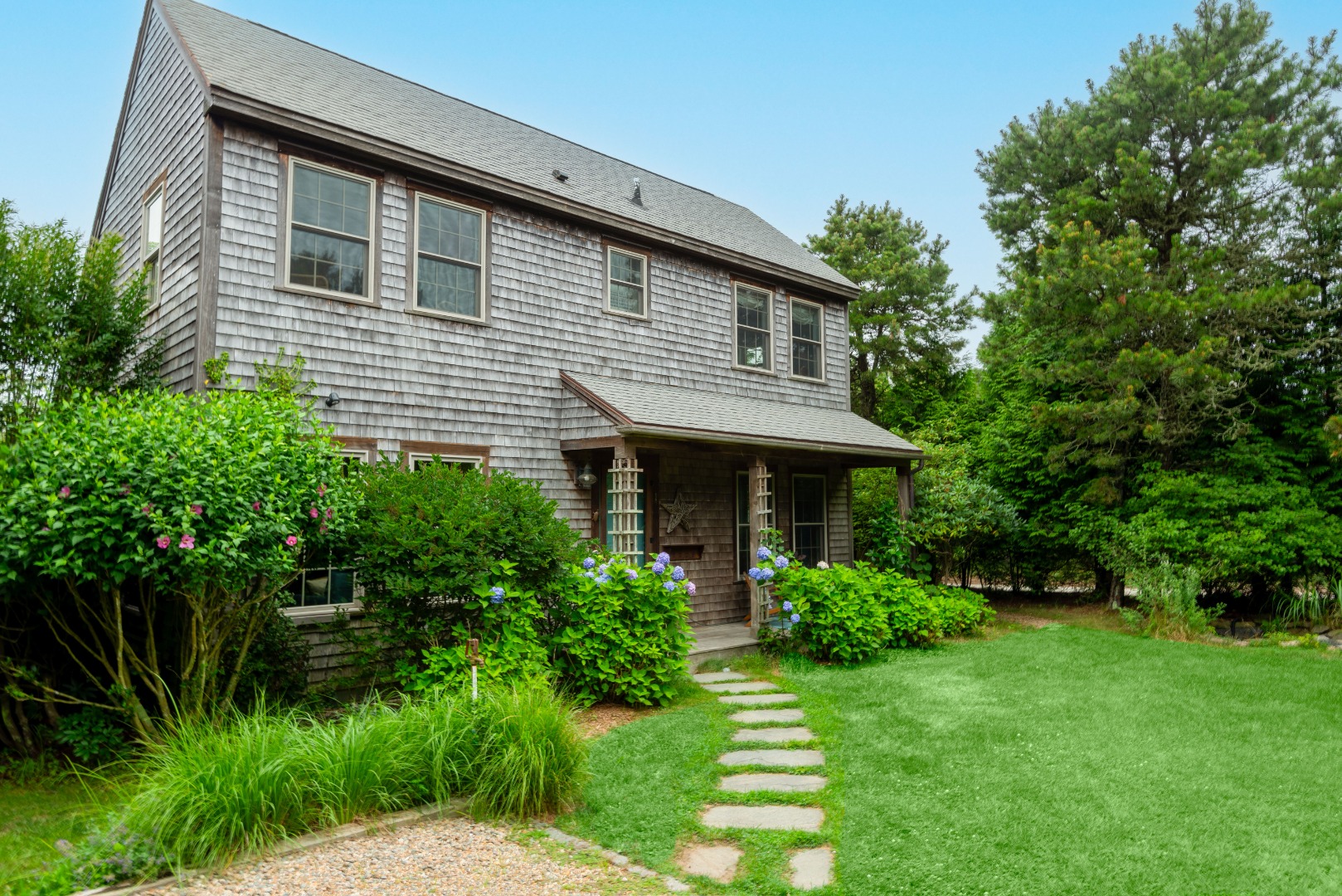 a front view of a house with a yard