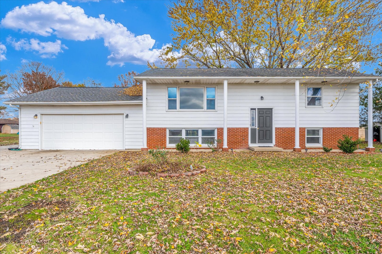 front view of a house with a yard