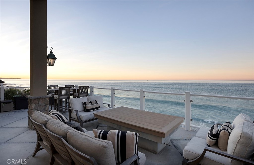 a terrace with a table and chairs