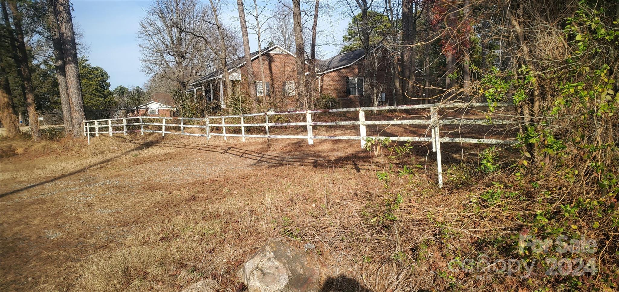 a view of a yard with an outdoor space