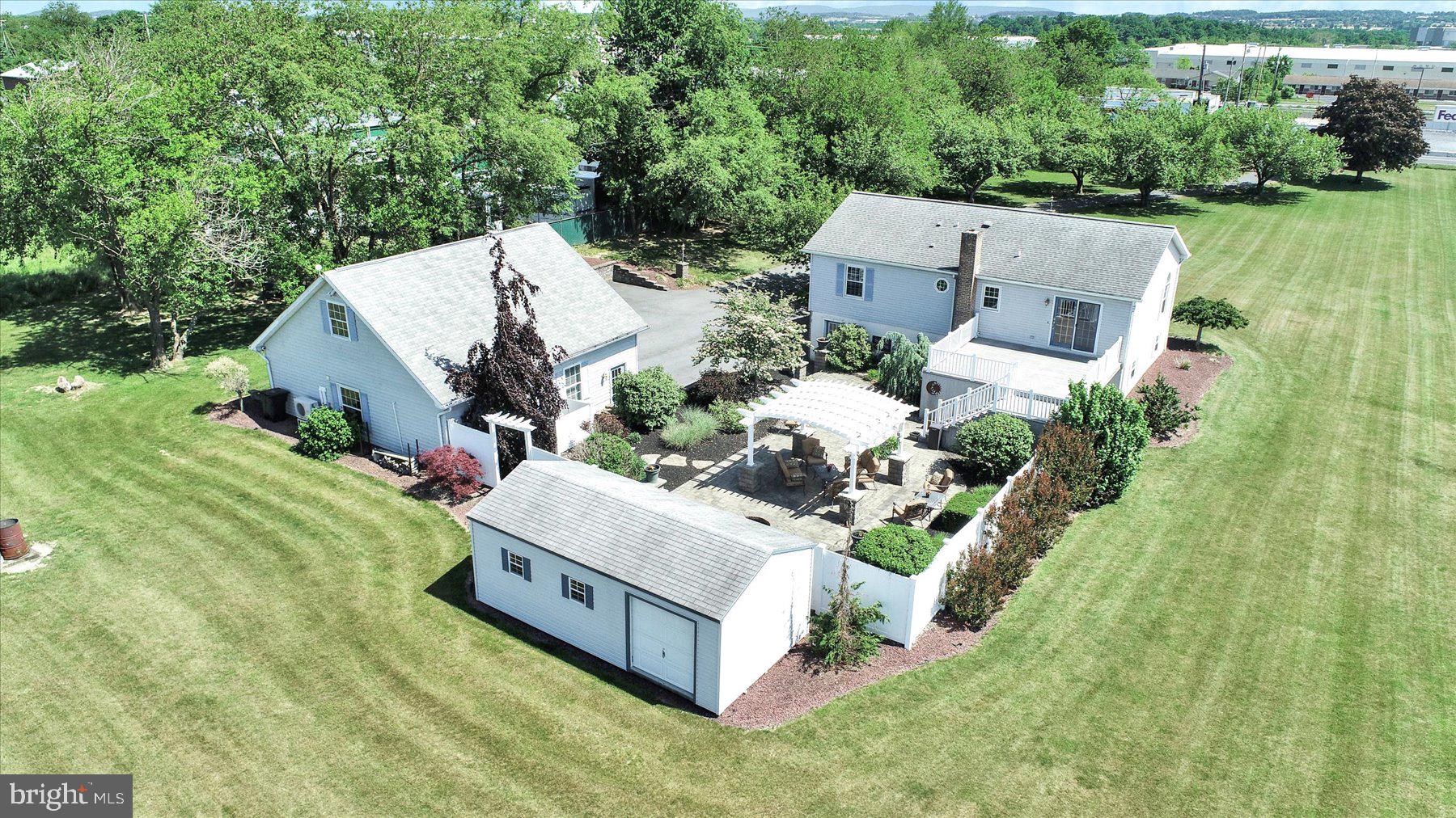 a view of a house with a yard and lake