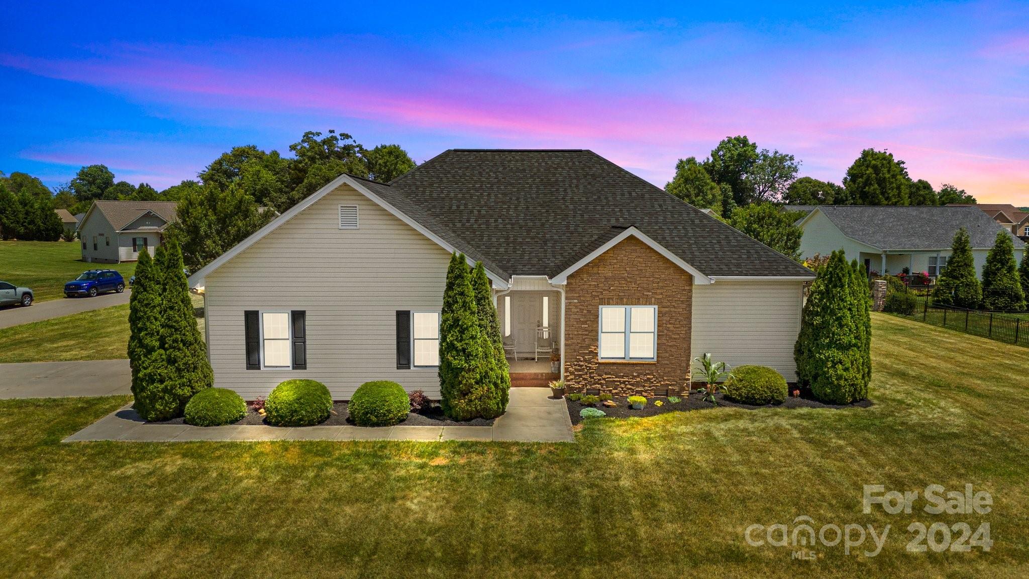 a front view of a house with a yard