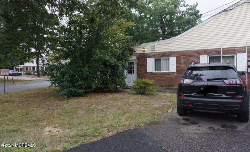 a car parked in front of a house